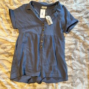 Size large muted blue romper short. NWT